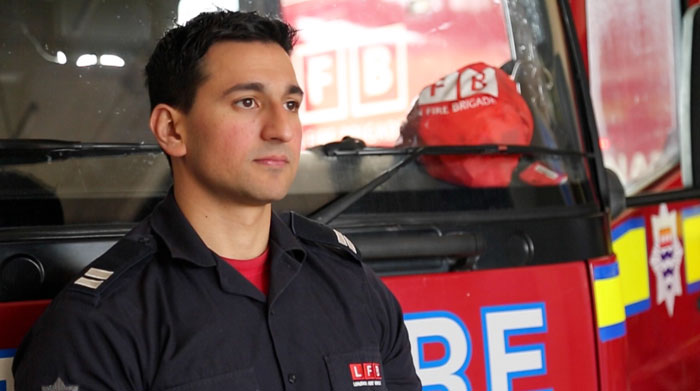 Firefighter, Raja stood in front of a fire engine
