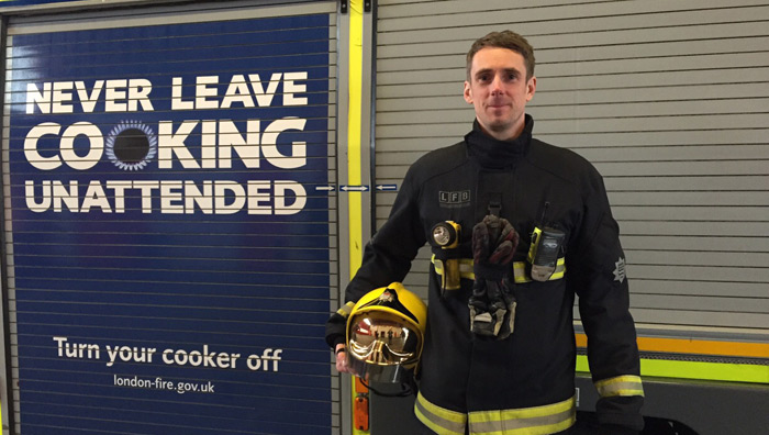 Firefighter, Mat Riley who appeared on The Great British Bake Off stood by a fire engine 