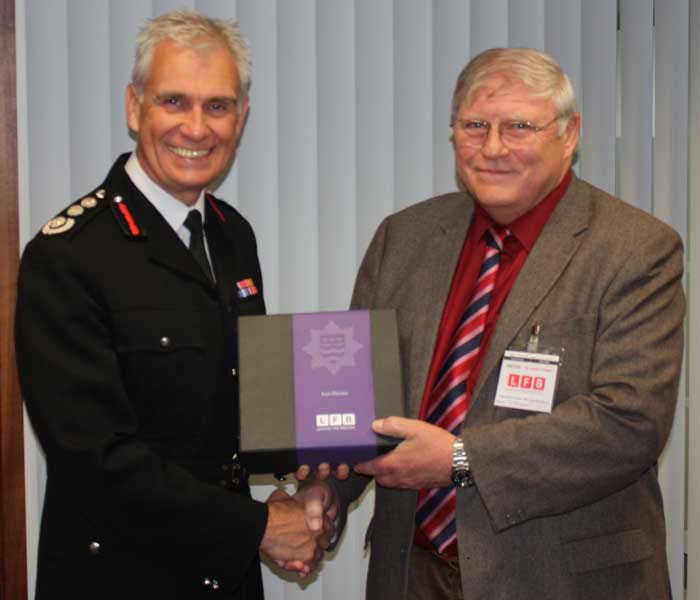 Previous Commissioner Ron Dobson awarding Ken Davies his fifty year service award