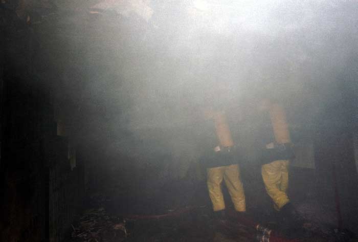 Historic photo of Firefighters attending to an incident 