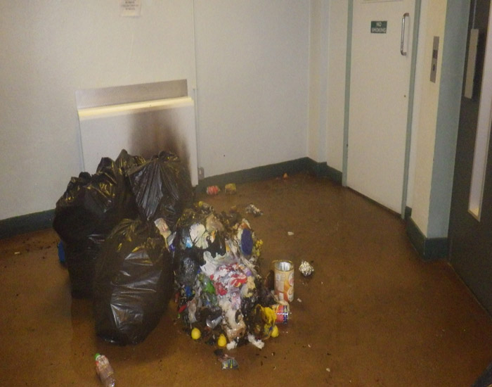 Burnt rubbish in a communal hallway 