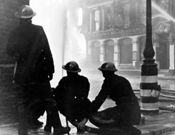 AFS firefighters at work with a hose