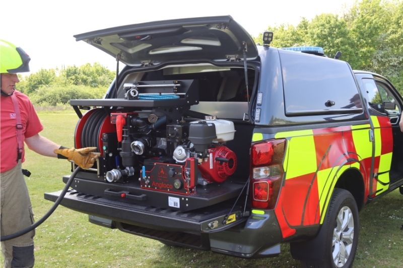 Wildfire response vehicle with the boot open showing equipment inside.
