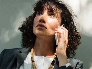 Woman holding a mobile phone.