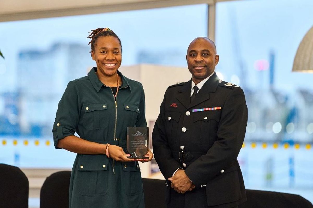 Tunrayo Deacon and Kevin Mackenzie holding an award