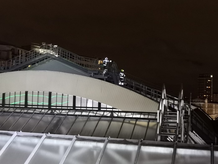Firefighters work on the roof of Victoria Station due to Storm Ciara