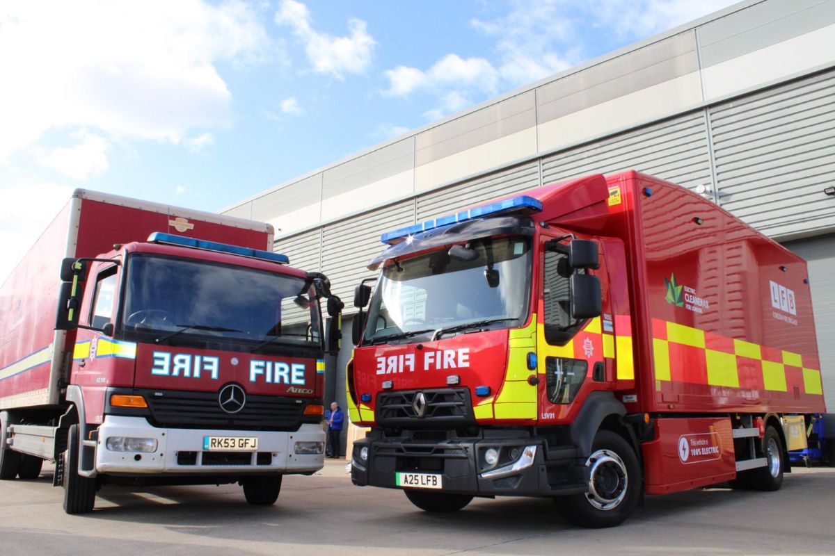 An old diesel London Fire Brigade operational support centre lorry on the left and the new electric lorry on the right