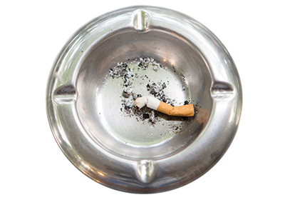 Cigarette in ashtray