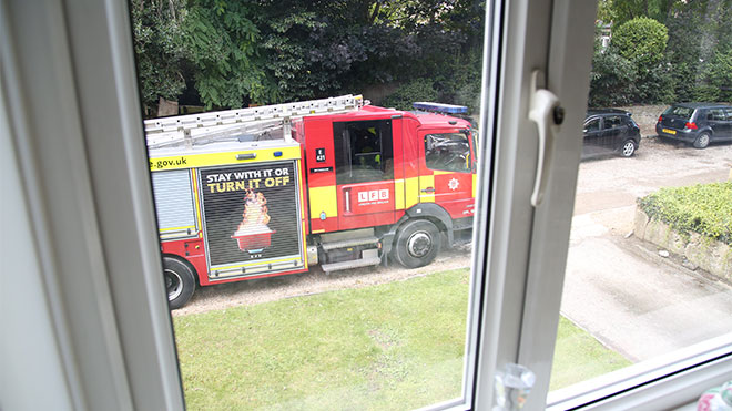 Fire Engine parked outside of a house