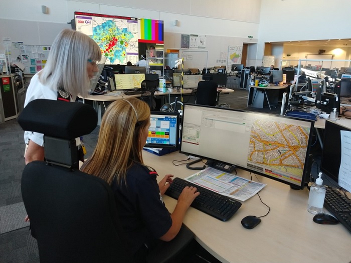 Control Room Officers looking at the 999Eye software on a computer screen