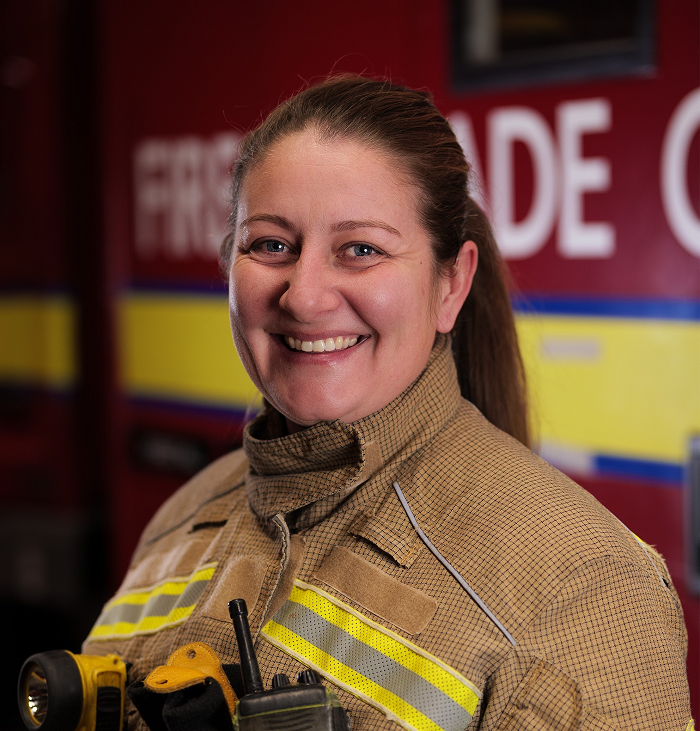 Ellie Voce in front of a fire engine
