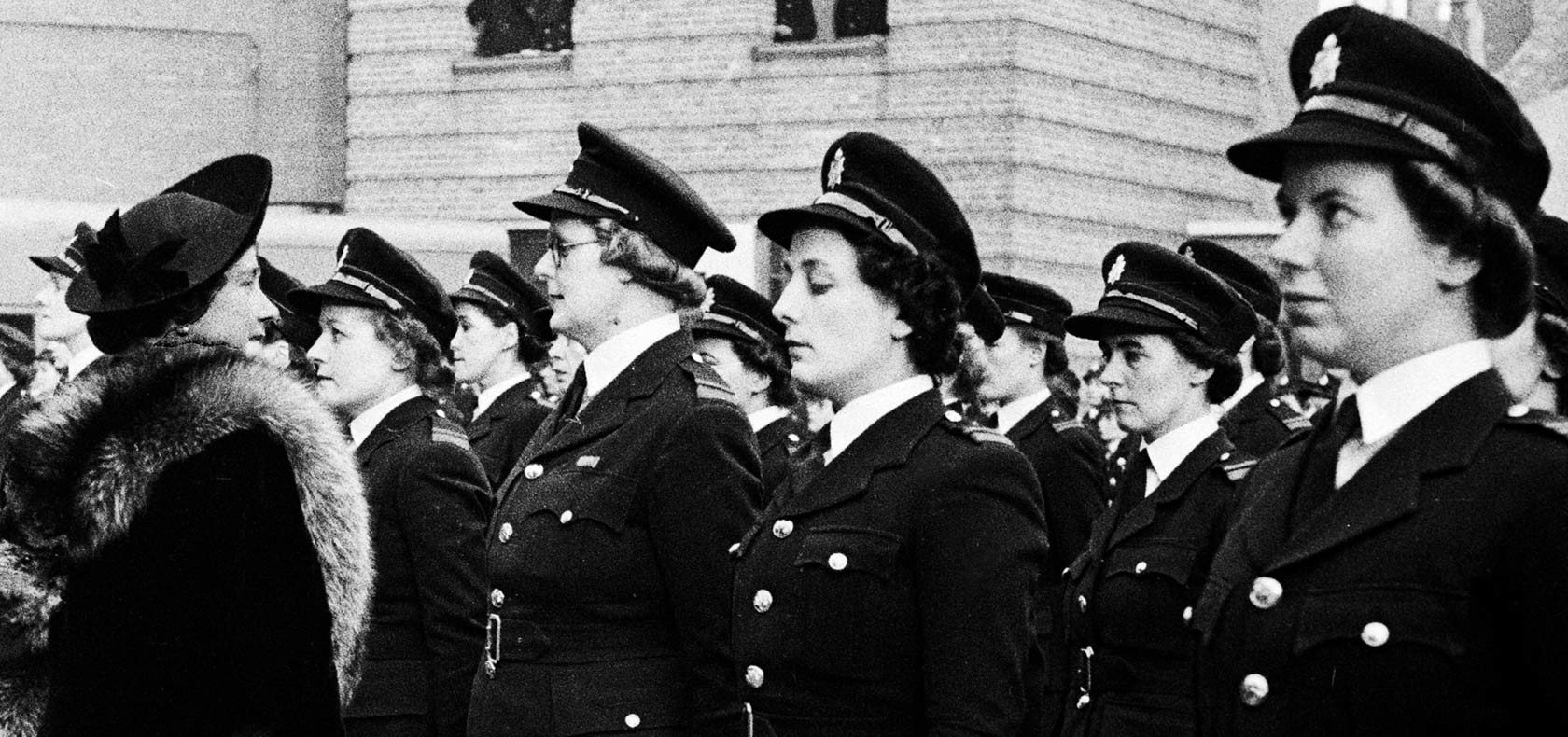National Fire Service Firewomen lined up in uniform.