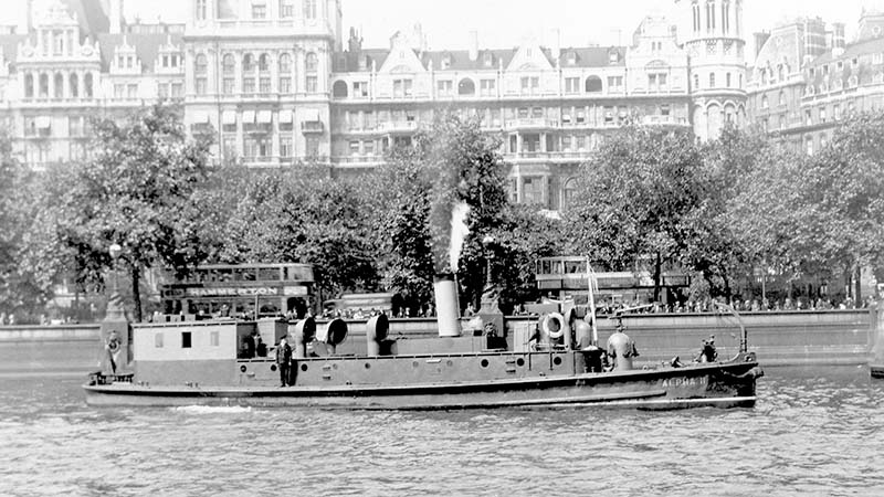 The fire boat Alpha II cruising down the Thames