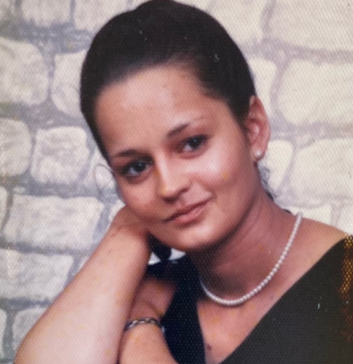 Photo of Magdalena Fink with her arm bent and head resting on hand
