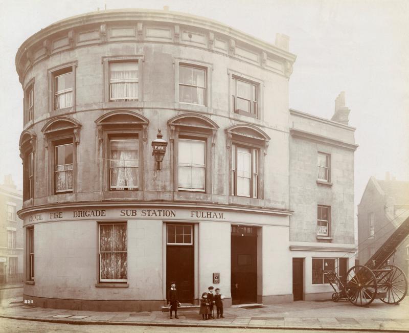Photograph of Fulham Fire Brigade Sub Station in the 1890s, showing the original station building and a wheeled escape ladder used by firefighters.