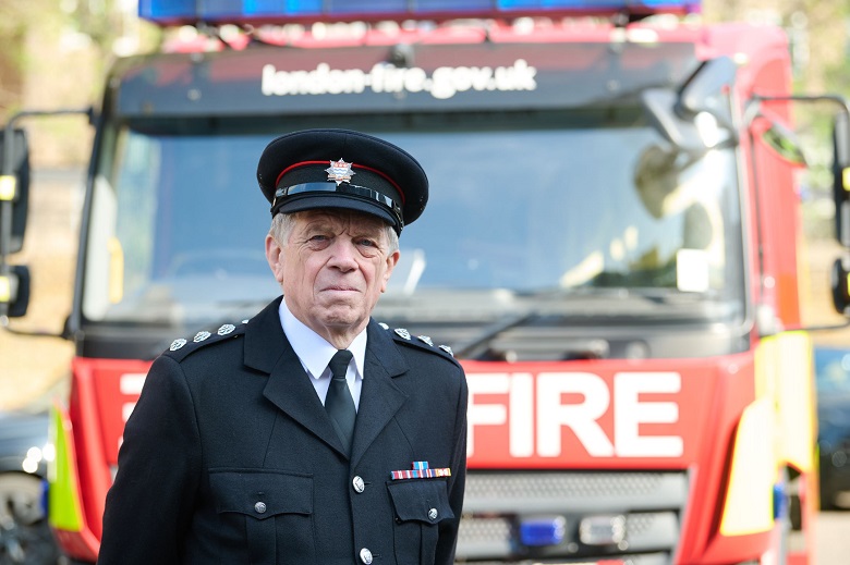 Station Commander Clive Robinson in front of a fire engine
