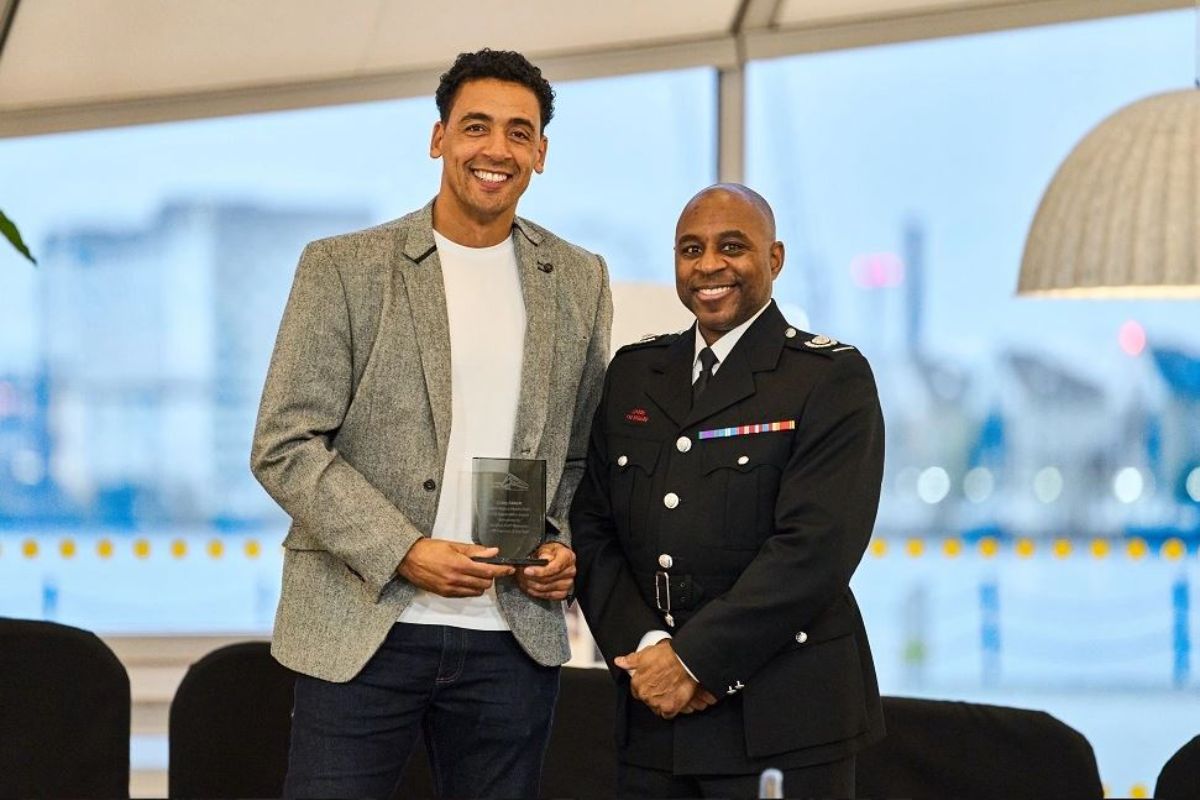 Craig Abbot and Kevin Mackenzie holding an award