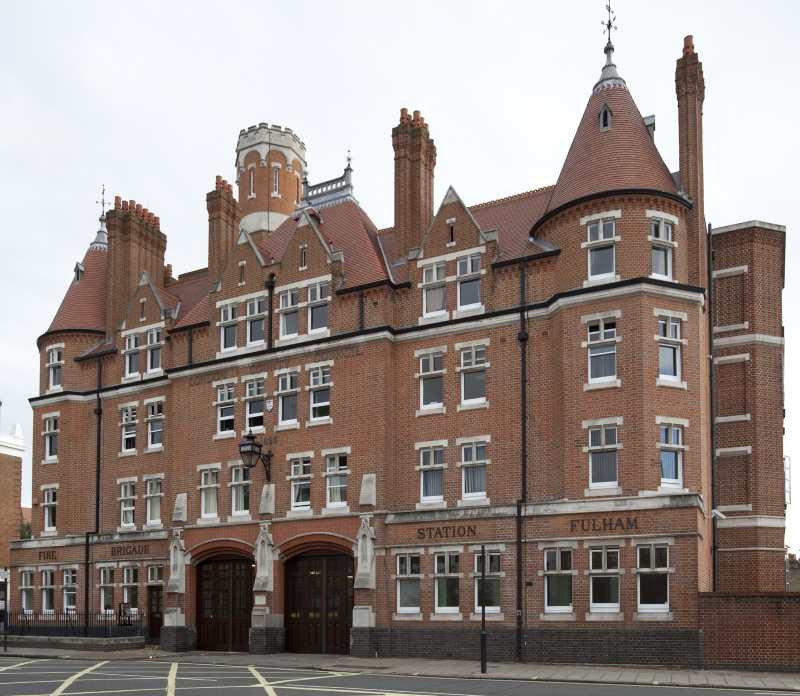 Photograph of Fulham Fire Station in 2008, showing the Grade II listed station building with its restored red-brick façade, distinctive corner turrets and central appliance bays still in operational use.